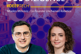 Two smiling individuals: a man in a blue sweater and glasses, and a woman in a light top. Background features tech-themed graphics.